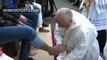 Pope Francis washes the feet of  Muslim refugees