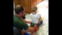 Dad Pushes Boy on Bike Dog Pulls Him Back