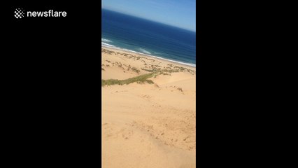 Man sandboards biggest sand dune in South Africa