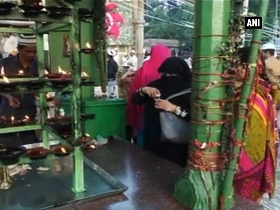 Hindus and Muslims pray together depicting a perfect example of communal harmony
