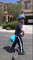 6 years old boy doing cool tricks on scooter