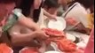 Chaos reigns as hungry Chinese tourists fight over jumbo shrimp in buffet restaurant in Thailand