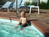 Brooks throwing the ball to Daddy in the pool