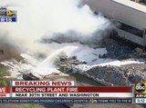 Recycling plant fire continues to burn