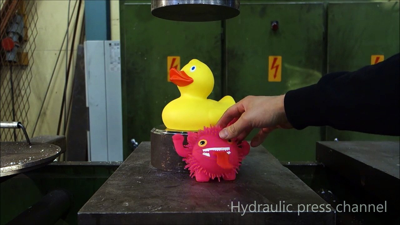 Crushing rubber duck with hydraulic press