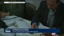 Syrians head to polls as peace talks resume