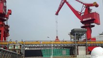 Unloading a Panamax vessel at a port on the Yangtze  river.