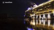 Time-lapse of cruise ship navigating narrow river at night