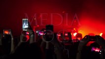 Making party at a rock concert and hold cameras with digital displays