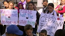 Refugees on the Greek island of Lesbos welcome Pope Francis