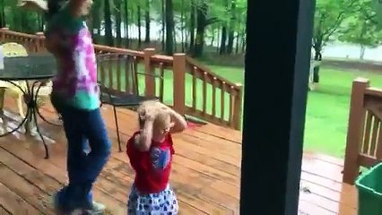 little kid Playing in rain