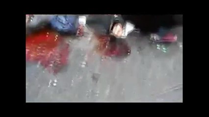 [GRAPHIC] Homs, Baba Amr. [26 Dec 2011]. Mortar shell blows civilians apart.