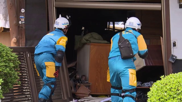 Rescuers race against landslides to reach Japan quake victims