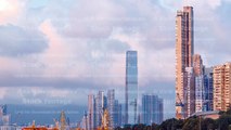 Hong Kong business center timelapse with a cloudy blue sky before sunset