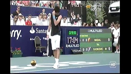 Novak Djokovic imitates Rafael Nadal in front of him