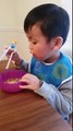 041616 Kyler's  first time using training chopsticks