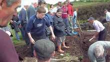 Turf Cutting in Glinsk, June '09 - Mickie Grady cutting, Andrew Grady catching