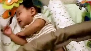 baby laughing while sleeping