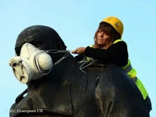 Greenpeace Activists Climb Nelson's Column and Put Gas Masks on Famous London Statues