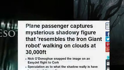 ENORMOUS SHADOWY FIGURE walking on clouds CAUGHT ON CAMERA by Plane passenger at 30,000ft