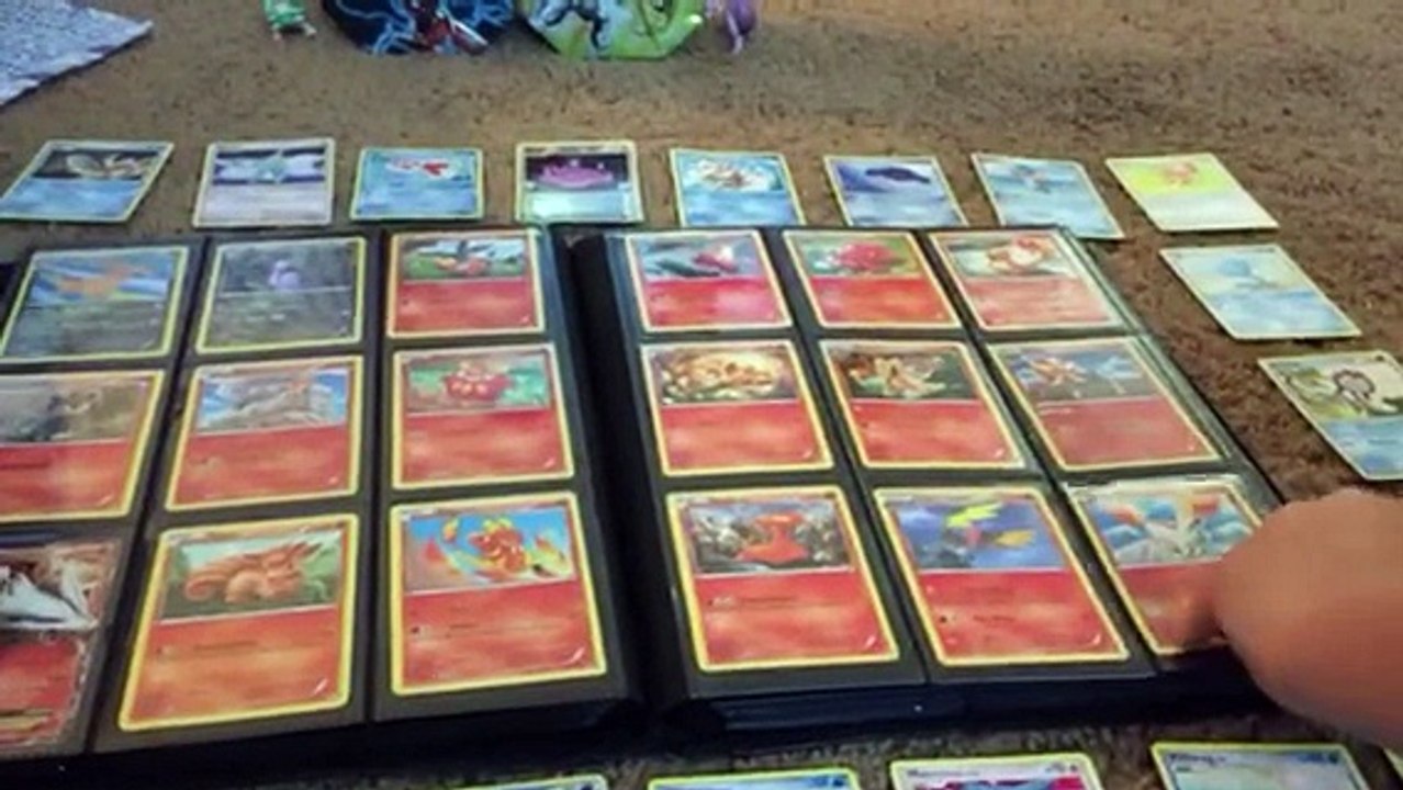 Opening binder full of Pokemon cards