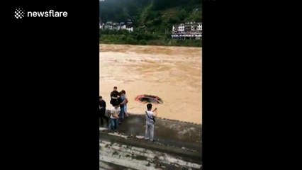 Severe flooding sweeps vehicles away