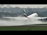 Landing Plane Kicks Up Massive Spray