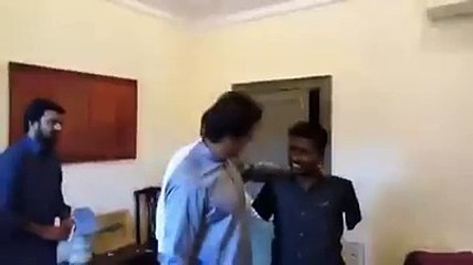 Imran Khan meets a worker and his family who has no arms in Bani Gala on his wish