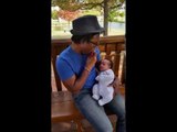 Loving Dad Plays Harmonica for His Son