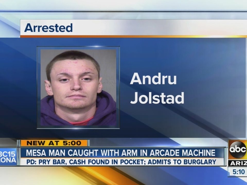 Mesa man caught with arm in arcade