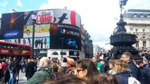 Guitarists outside Piccadilly circus