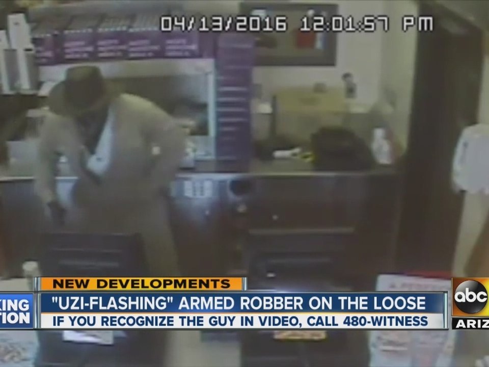 Uzi flashing armed robber on the loose