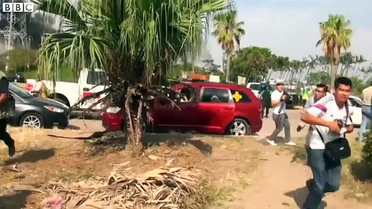 Footage shows plumes of black smoke rising over the oil plant