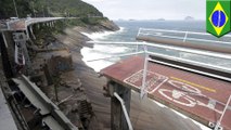 Two killed when giant waves send world's 'most beautiful' bike path crashing into the sea