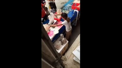 Hidden Camera Footage Shows How Seafood Vendor Cheats Her Customers