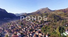 Aerial Flight Above Sunny Mountain Town, 4K, aerial drone