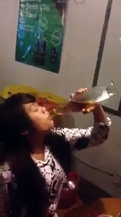 Cambodia, Young girl Drink Wine One bottle one time