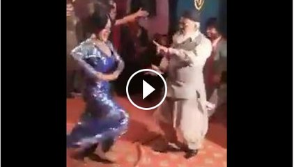 Old man dance in party with baby doll