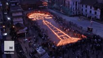 Candlelights recreate historic tower destroyed by Nepal earthquake, a year ago