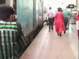 Woman slips from train platform, escapes miraculously