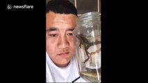 Man drinks live fish, frogs and tadpoles with water