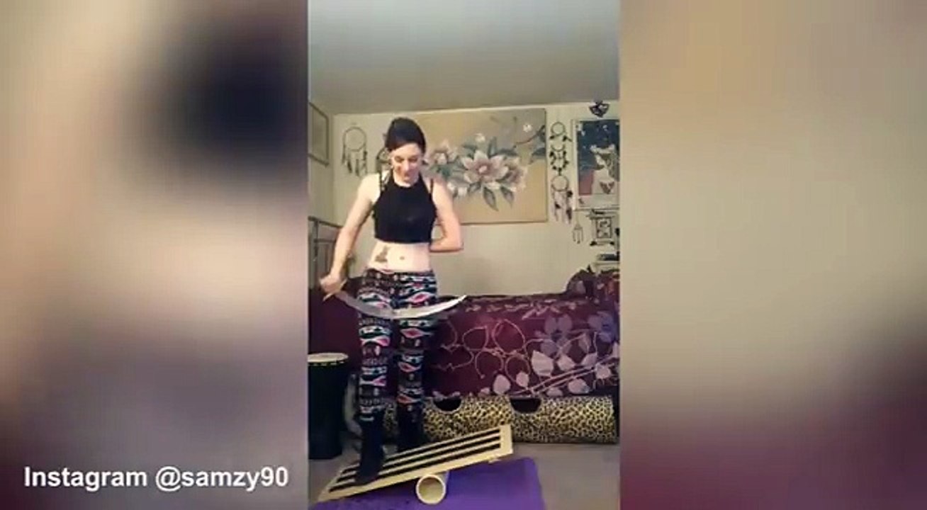 Performer juggles knives while standing on balance board