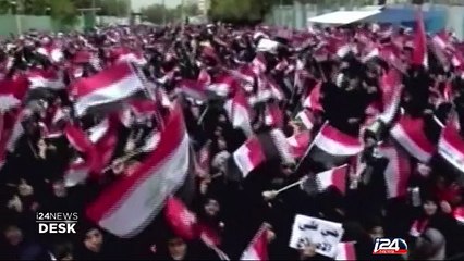 Iraq: tens of thousands take to streets as PM attacked in parliament