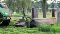 John Deere 6510 mowing grass