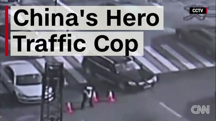 Quick Thinking Traffic Cop Saves Motorists from Massive Sinkhole in China