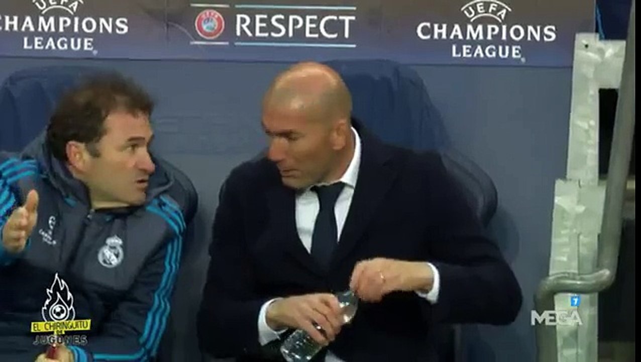 Zidane talks to staff member about his ripped pant, but doesn’t care about it and walks back to the sideline.