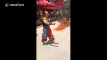 Man walks through fire, barefoot