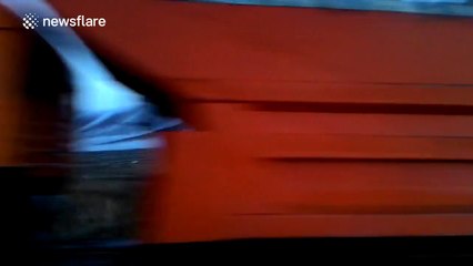 Fog flows over hills like a waterfall