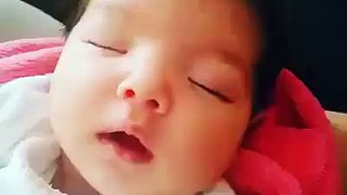 Cute Baby Smiles  In A Deep Sleep