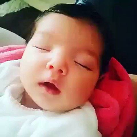 Cute Baby Smiles  In A Deep Sleep